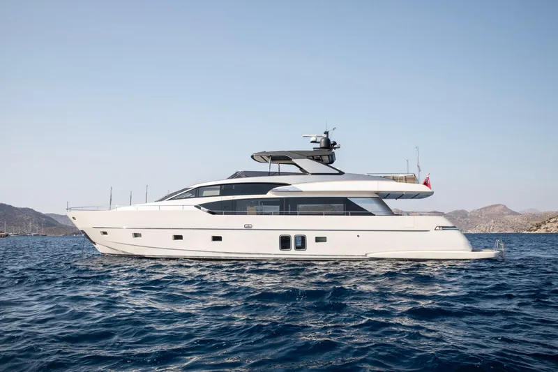  Yacht Photos Pics 2017 Sanlorenzo SL86 yacht on open water, clear sky, distant hills.