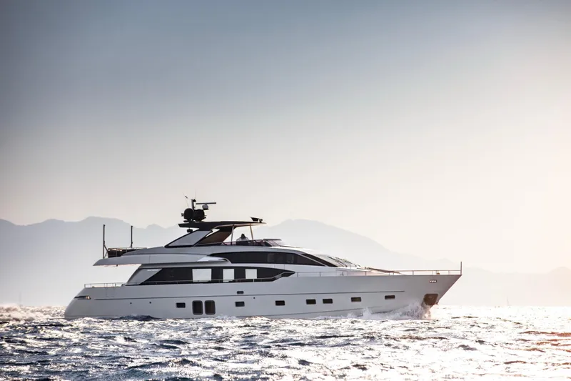  Yacht Photos Pics Luxurious 2017 Sanlorenzo SL86 yacht cruising on open water at sunset.