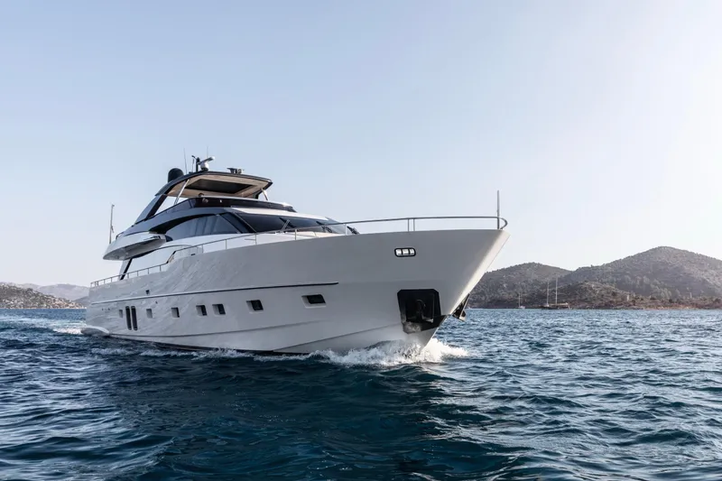  Yacht Photos Pics 2017 Sanlorenzo SL86 yacht cruising on open water with scenic background.