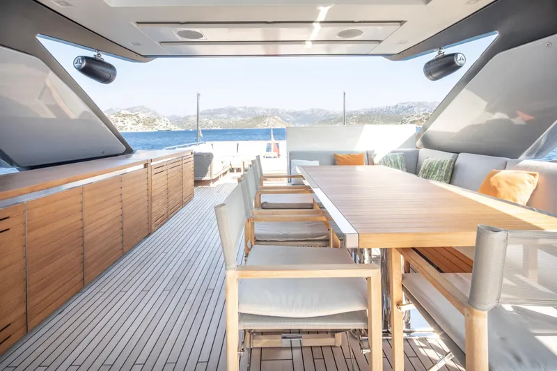  Yacht Photos Pics Luxurious 2017 Sanlorenzo SL86 yacht deck with elegant dining area and scenic ocean view.