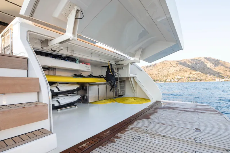  Yacht Photos Pics Open storage area on 2017 Sanlorenzo SL86 yacht, featuring water sports equipment.