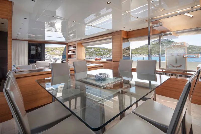  Yacht Photos Pics Luxurious interior of 2017 Sanlorenzo SL86 yacht with glass dining table and scenic ocean view.