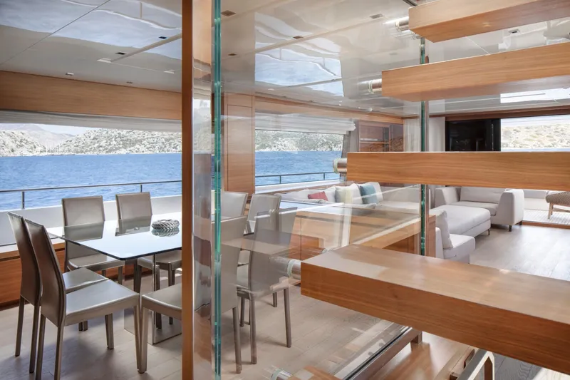  Yacht Photos Pics Luxurious interior of 2017 Sanlorenzo SL86 yacht with modern dining area and sea view.