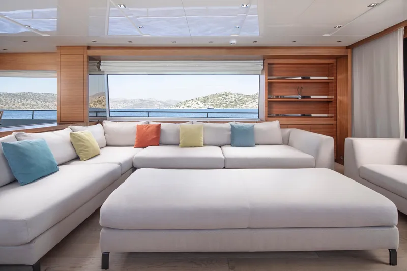  Yacht Photos Pics Luxurious Sanlorenzo SL86 yacht interior with spacious seating and colorful cushions, overlooking serene ocean views.