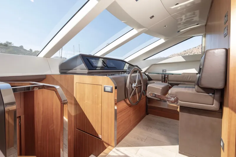  Yacht Photos Pics Luxurious interior of 2017 Sanlorenzo SL86 yacht with modern helm and leather seating.