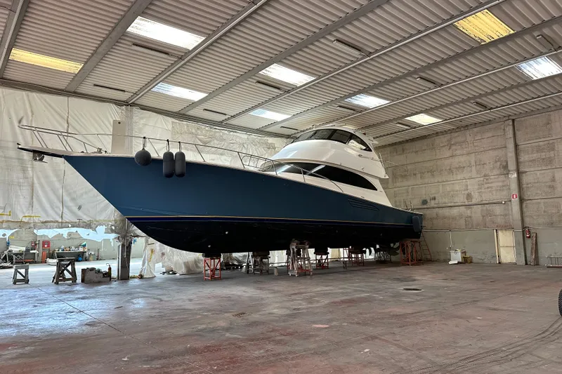 Tia Yacht Photos Pics 2017 Viking 62 Enclosed Bridge yacht in a spacious indoor facility.