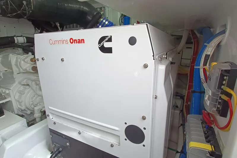 Tia Yacht Photos Pics Engine room of 2017 Viking 62 Enclosed Bridge with Cummins Onan generator.