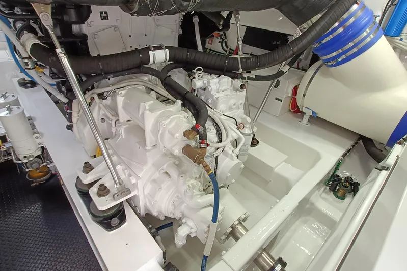 Tia Yacht Photos Pics Engine room of 2017 Viking 62 Enclosed Bridge yacht, showcasing mechanical components.