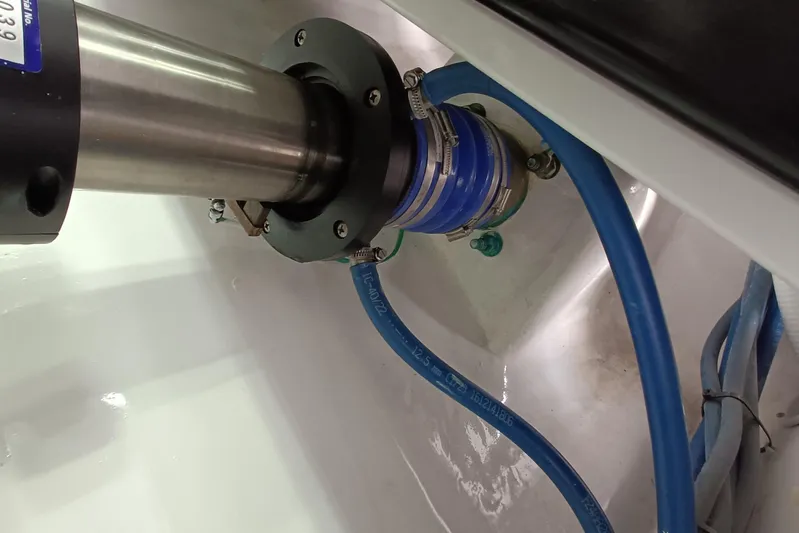 Tia Yacht Photos Pics Engine room detail of 2017 Viking 62 Enclosed Bridge yacht, showing mechanical components and hoses.