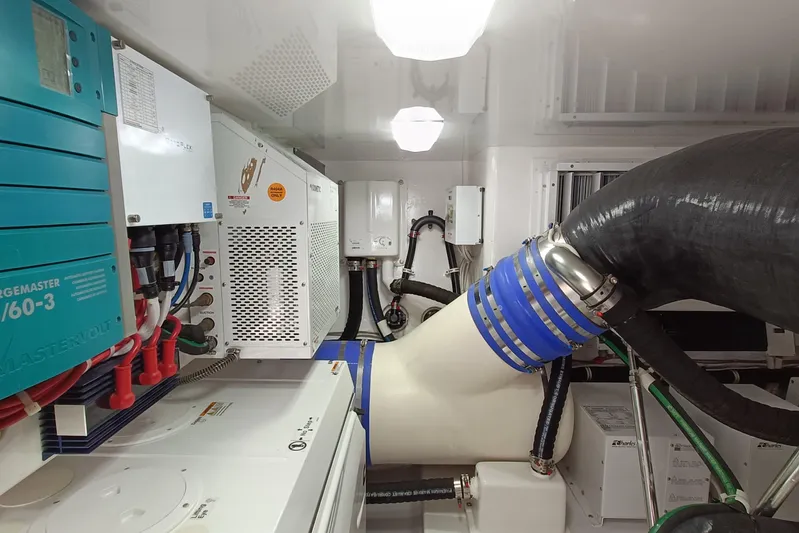 Tia Yacht Photos Pics Engine room of 2017 Viking 62 Enclosed Bridge yacht with advanced equipment and systems.