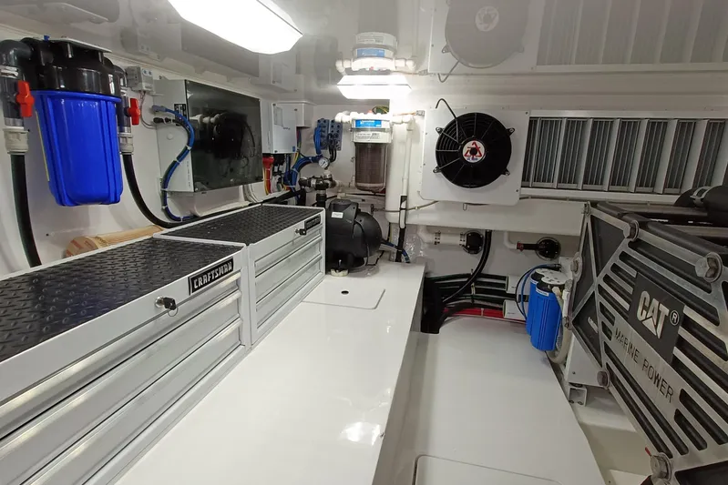 Tia Yacht Photos Pics Engine room of 2017 Viking 62 Enclosed Bridge yacht with CAT marine power system.
