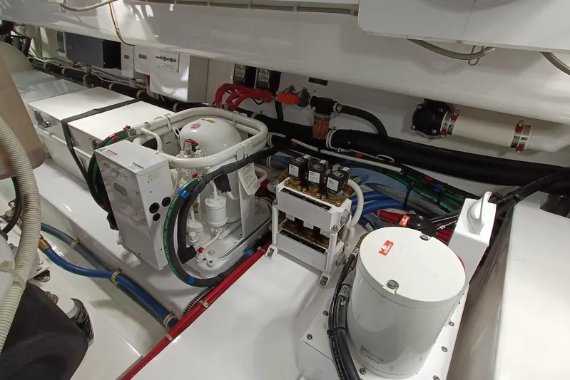 Tia Yacht Photos Pics Engine room of 2017 Viking 62 Enclosed Bridge yacht with mechanical components.