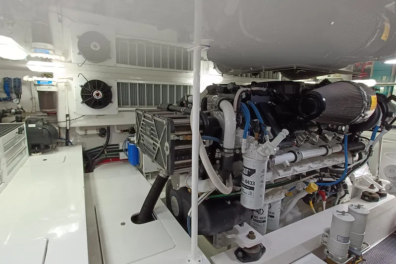 Tia Yacht Photos Pics Engine room of 2017 Viking 62 Enclosed Bridge yacht, showcasing machinery and components.
