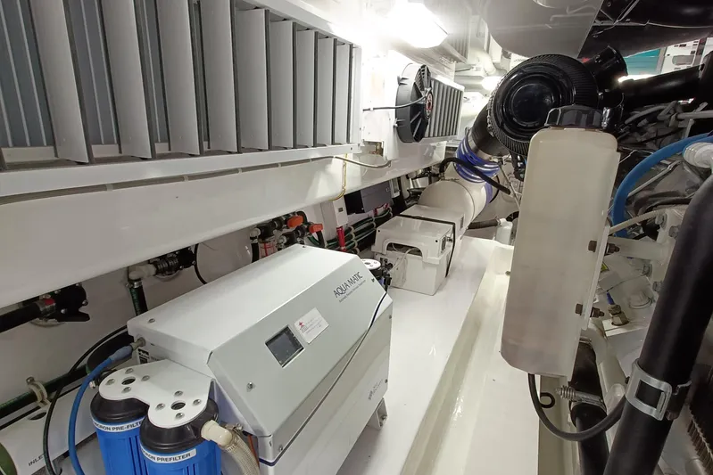 Tia Yacht Photos Pics Engine room of 2017 Viking 62 Enclosed Bridge yacht with water filtration system.