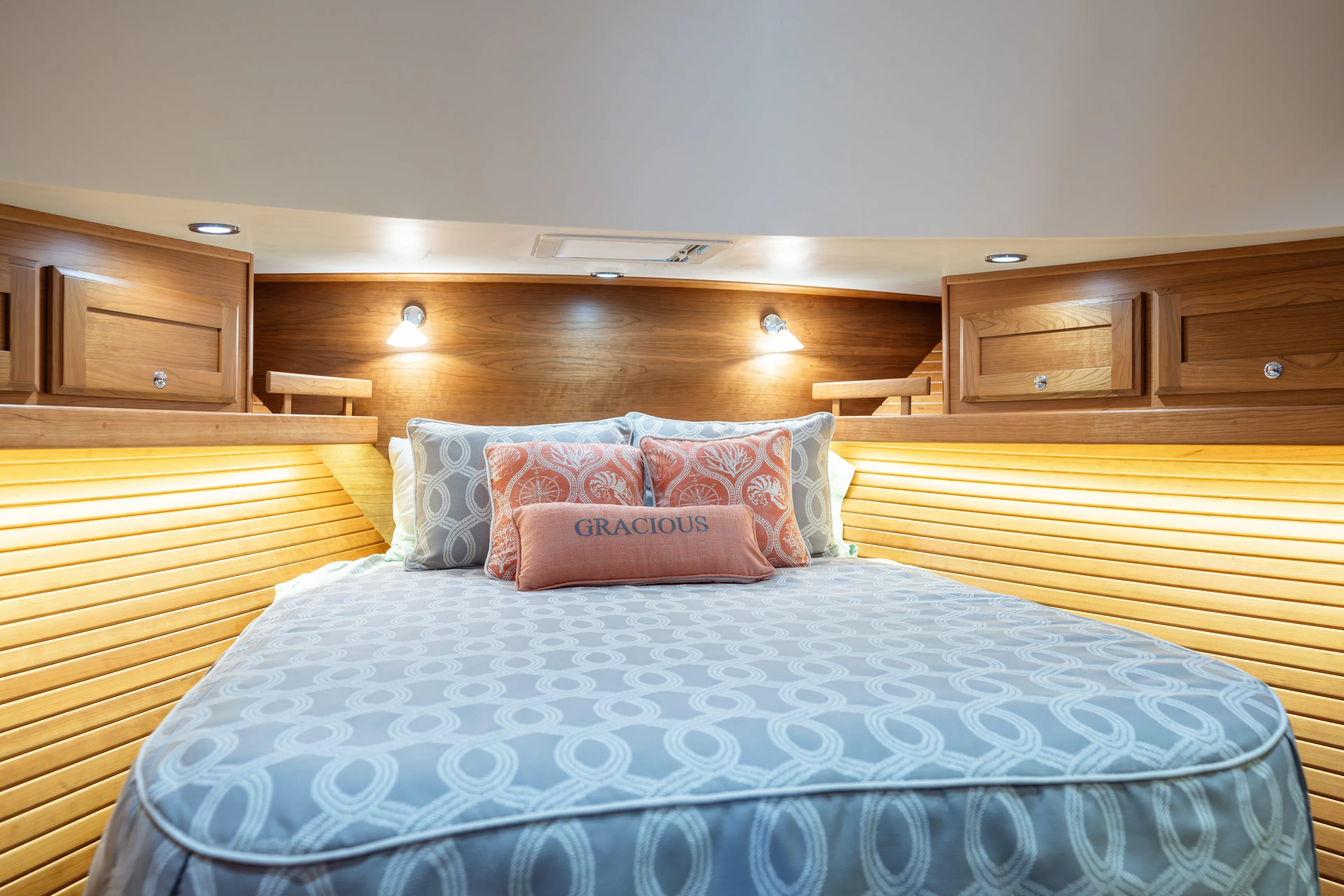 Gracious Yacht Photos Pics Luxurious cabin interior of 2020 Sabre 48 Salon Express yacht with cozy bedding.