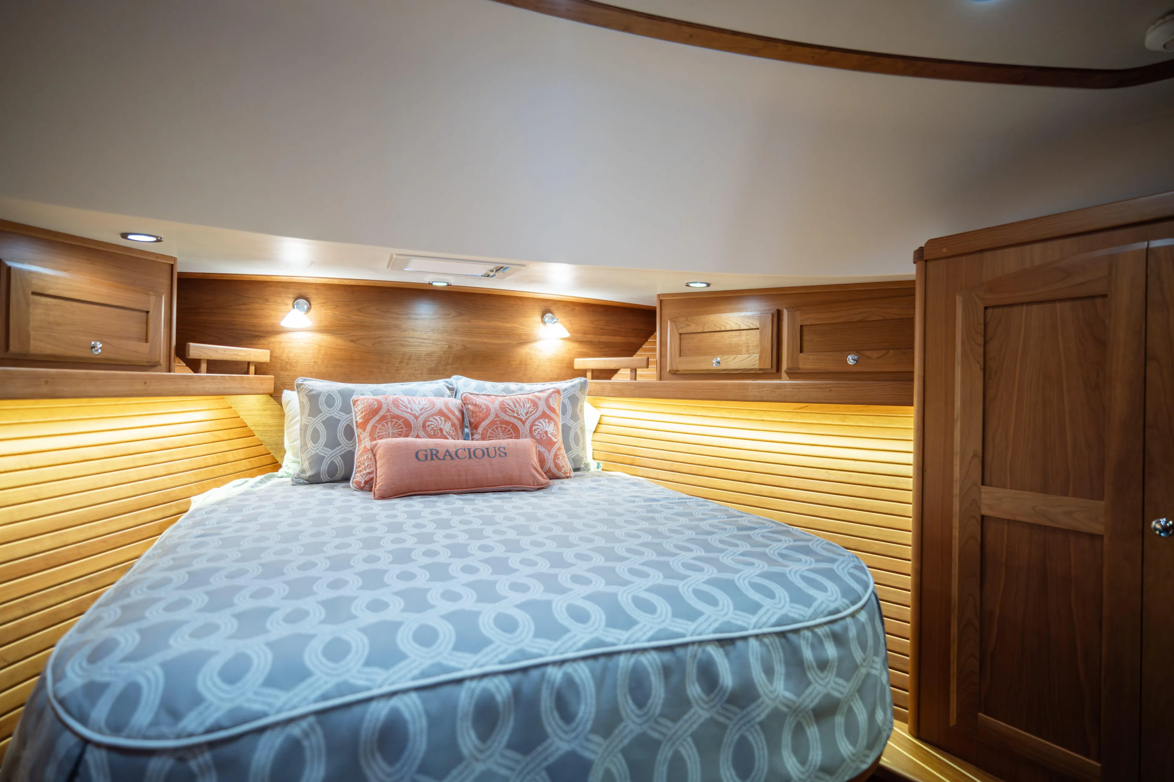 Gracious Yacht Photos Pics Luxurious bedroom interior of 2020 Sabre 48 Salon Express yacht with elegant wood finish.