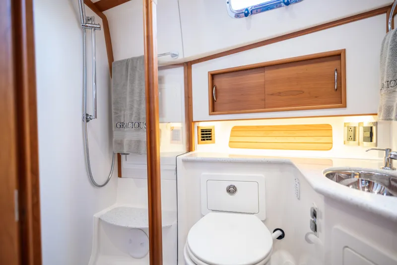 Gracious Yacht Photos Pics Luxurious bathroom in 2020 Sabre 48 Salon Express yacht with modern fixtures and wooden accents.