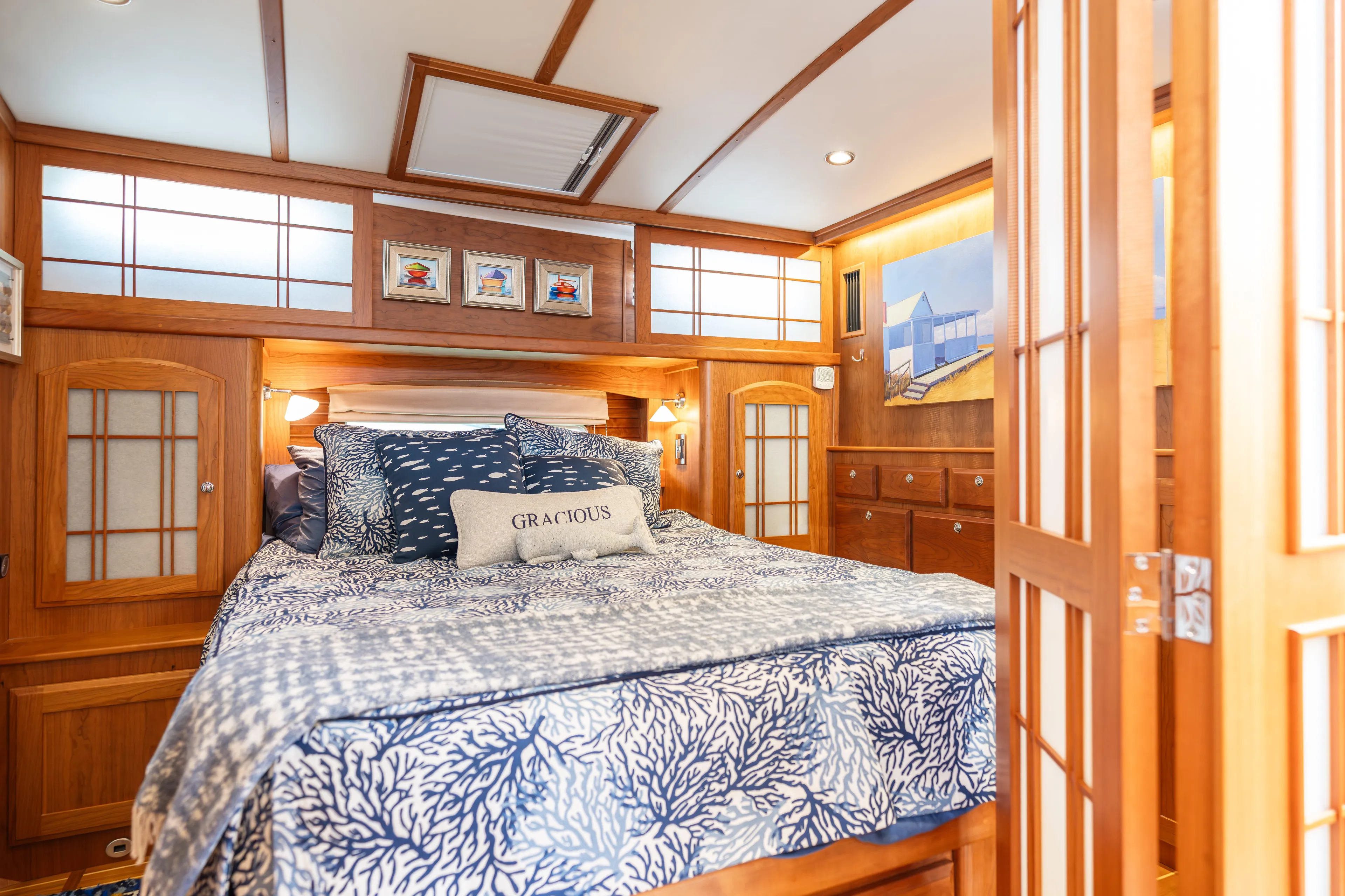Gracious Yacht Photos Pics Luxurious bedroom interior of 2020 Sabre 48 Salon Express yacht with elegant wood finishes.