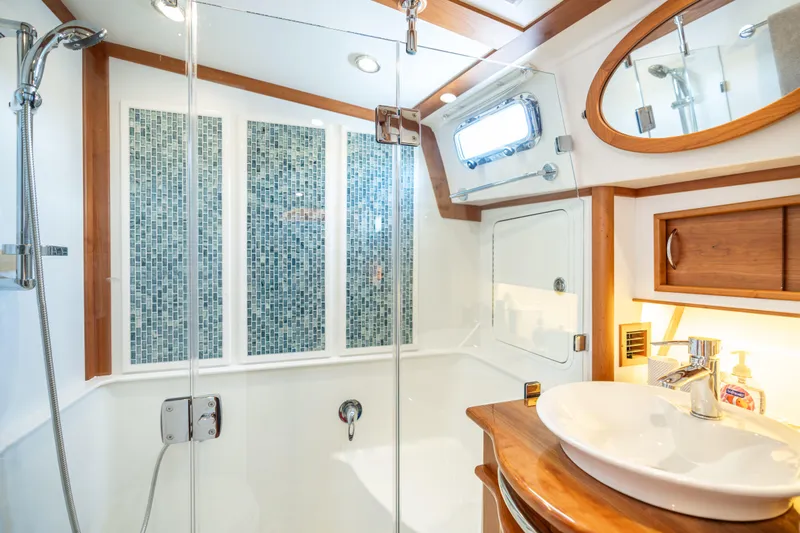 Gracious Yacht Photos Pics Luxurious bathroom in 2020 Sabre 48 Salon Express yacht with modern fixtures and elegant design.