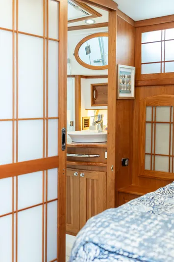 Gracious Yacht Photos Pics Interior of 2020 Sabre 48 Salon Express yacht with wooden accents and modern bathroom.
