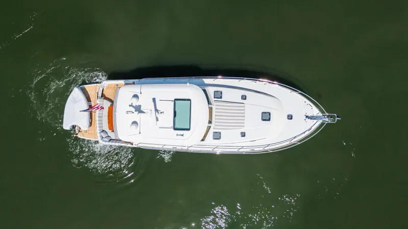 Gracious Yacht Photos Pics Aerial view of 2020 Sabre 48 Salon Express yacht cruising on water.
