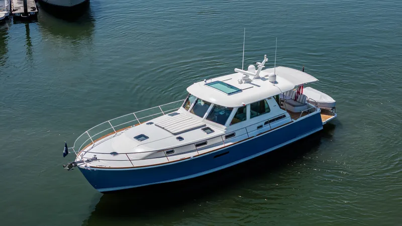 Gracious Yacht Photos Pics 2020 Sabre 48 Salon Express yacht on calm water, showcasing sleek design and luxury features.