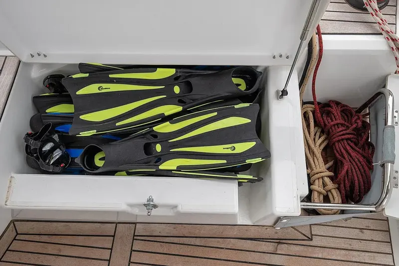  Yacht Photos Pics Storage compartment on 2021 Beneteau Oceanis 46.1 with diving fins and coiled ropes.