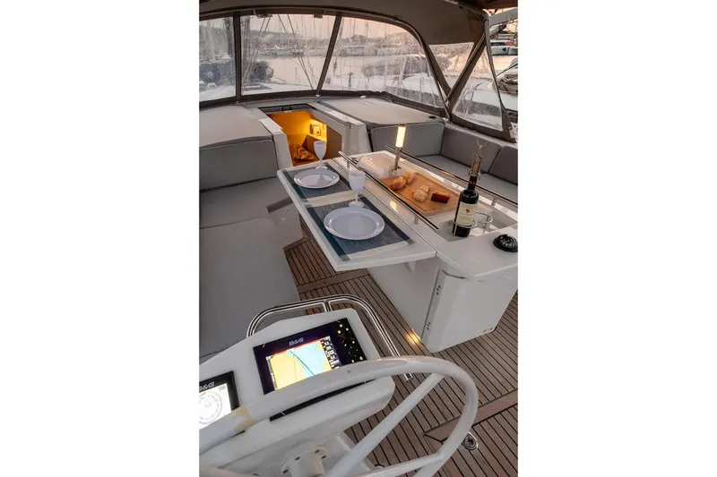  Yacht Photos Pics Luxurious 2021 Beneteau Oceanis 46.1 yacht interior with elegant dining setup.