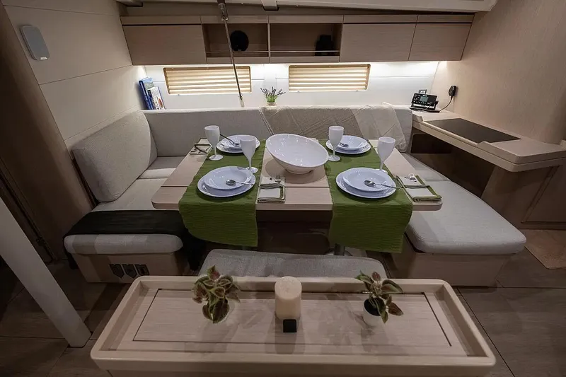  Yacht Photos Pics Interior of 2021 Beneteau Oceanis 46.1 yacht with elegant dining setup.
