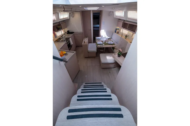  Yacht Photos Pics Interior of 2021 Beneteau Oceanis 46.1 yacht, featuring modern kitchen and dining area.