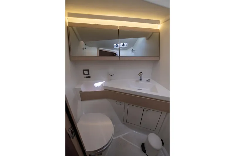  Yacht Photos Pics Modern bathroom interior of 2021 Beneteau Oceanis 46.1 yacht, featuring sleek design and fixtures.