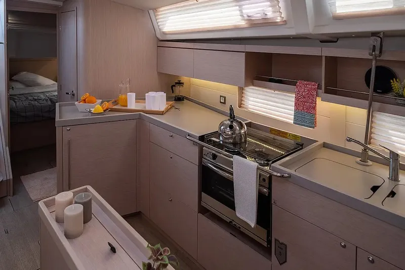  Yacht Photos Pics Modern kitchen interior of 2021 Beneteau Oceanis 46.1 yacht with sleek design and amenities.