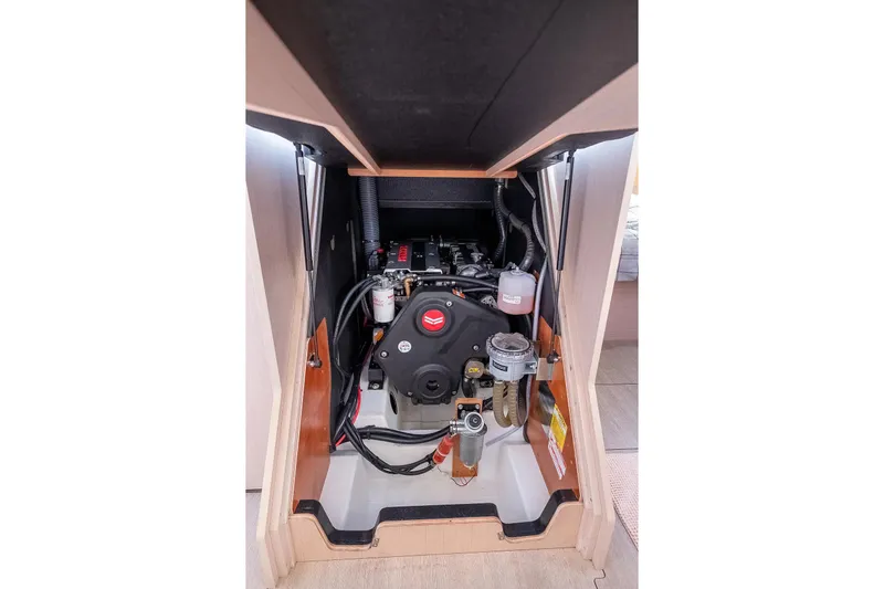  Yacht Photos Pics Engine compartment of 2021 Beneteau Oceanis 46.1 sailboat, showcasing mechanical components.