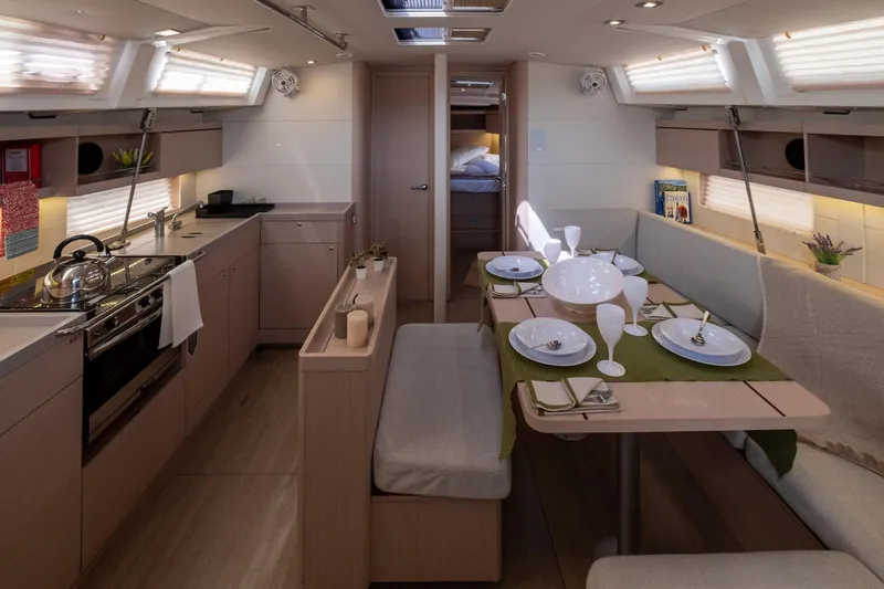  Yacht Photos Pics Interior of 2021 Beneteau Oceanis 46.1 yacht, featuring modern kitchen and dining area.