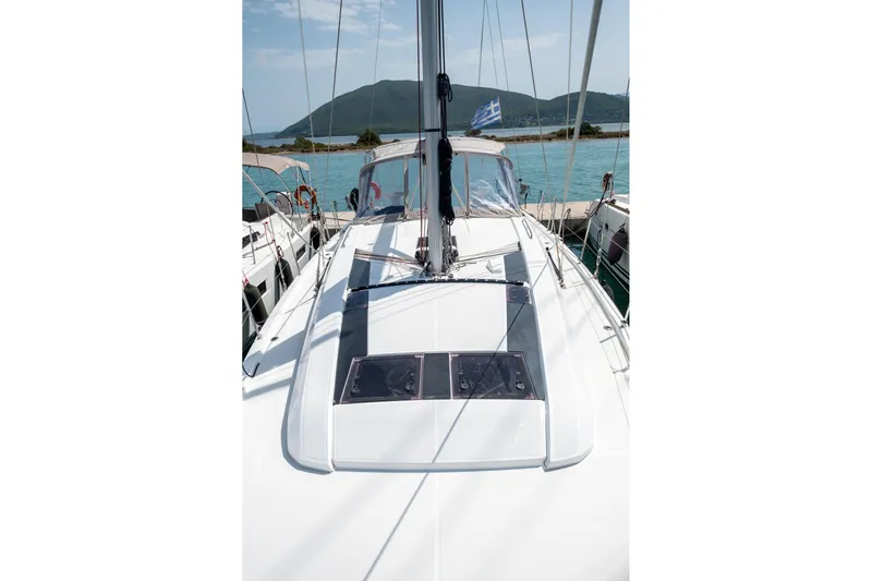  Yacht Photos Pics 2021 Beneteau Oceanis 46.1 sailboat docked with scenic mountain backdrop.