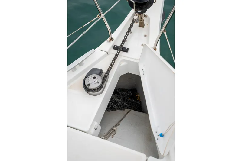  Yacht Photos Pics Anchor chain locker on 2021 Beneteau Oceanis 46.1 sailboat, featuring open hatch and chain.