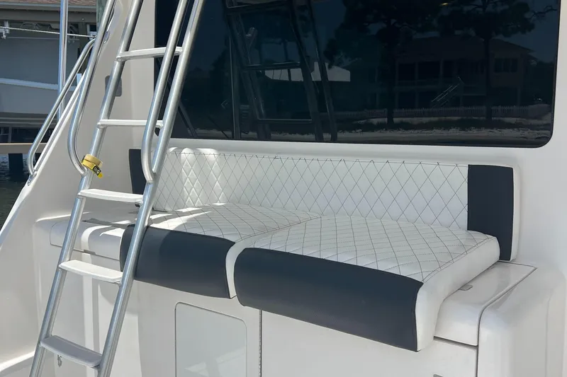  Yacht Photos Pics Cabo 40 Flybridge 2005 boat with cushioned seating and ladder.