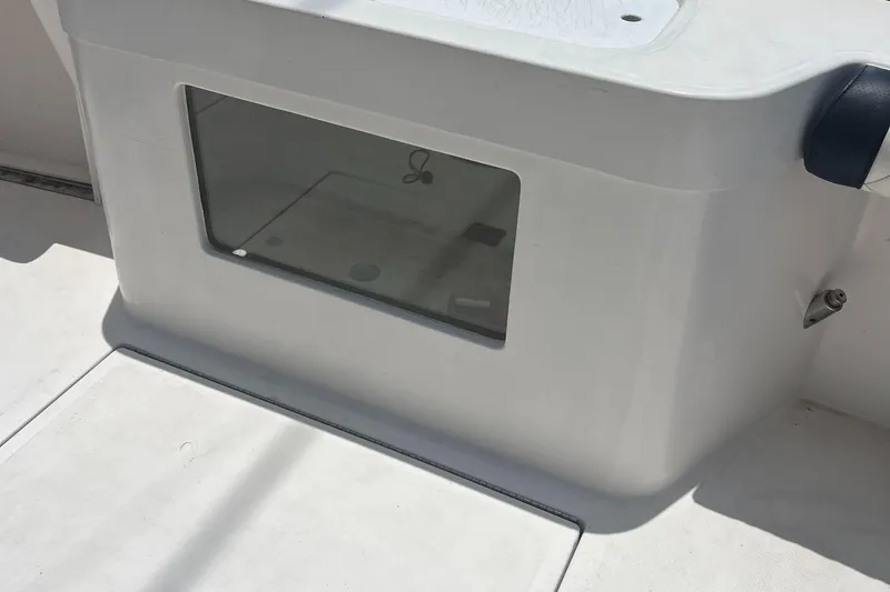  Yacht Photos Pics 2005 Cabo 40 Flybridge boat interior detail with storage compartment.