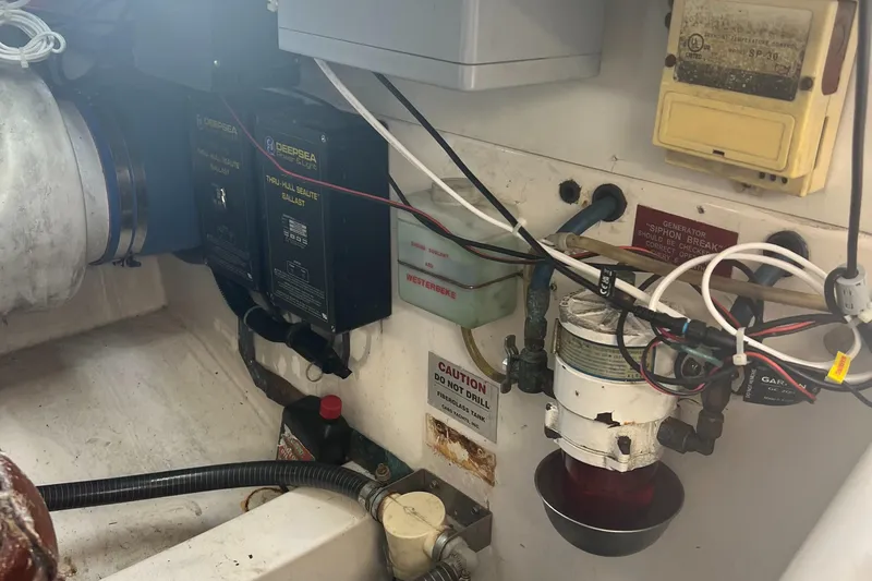  Yacht Photos Pics Engine room of 2005 Cabo 40 Flybridge with wiring and equipment.