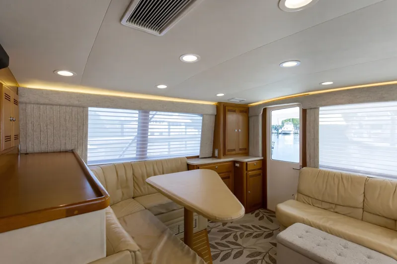  Yacht Photos Pics Luxurious interior of 2005 Cabo 40 Flybridge yacht with elegant seating and modern design.