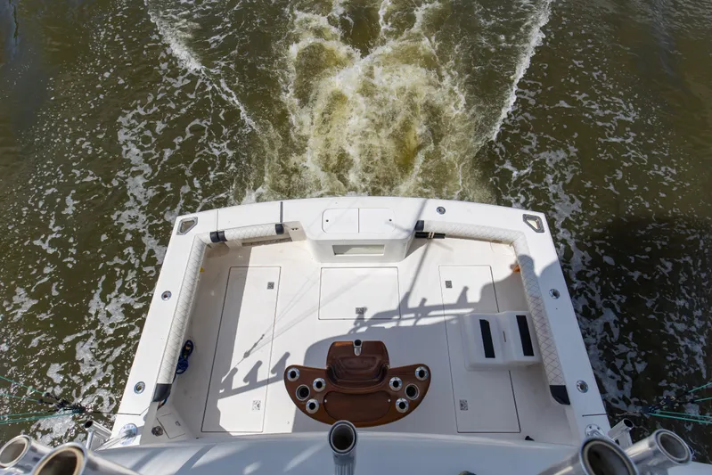  Yacht Photos Pics 2005 Cabo 40 Flybridge boat deck with water wake in motion.