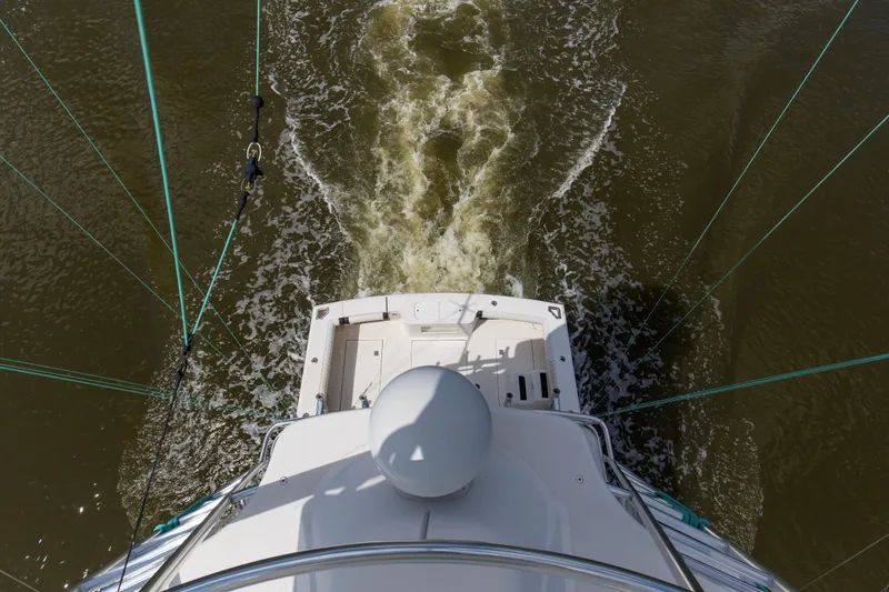  Yacht Photos Pics Aerial view of 2005 Cabo 40 Flybridge yacht navigating through water.