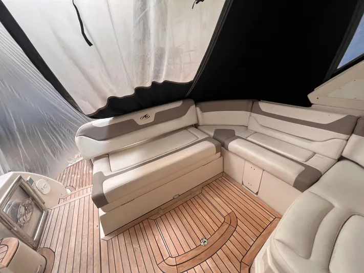  Yacht Photos Pics 2009 Monterey 415 SY yacht interior with beige seating and wooden flooring.