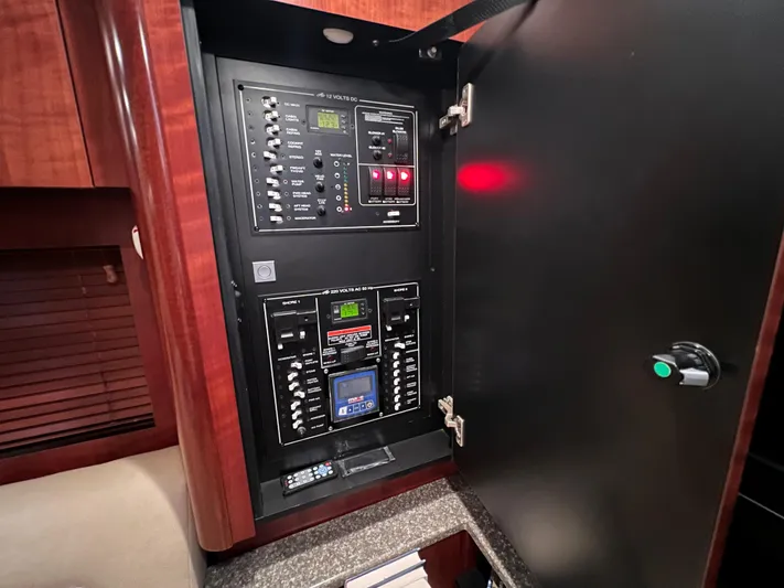  Yacht Photos Pics Electrical control panel inside a 2009 Monterey 415 SY yacht, featuring switches and digital displays.