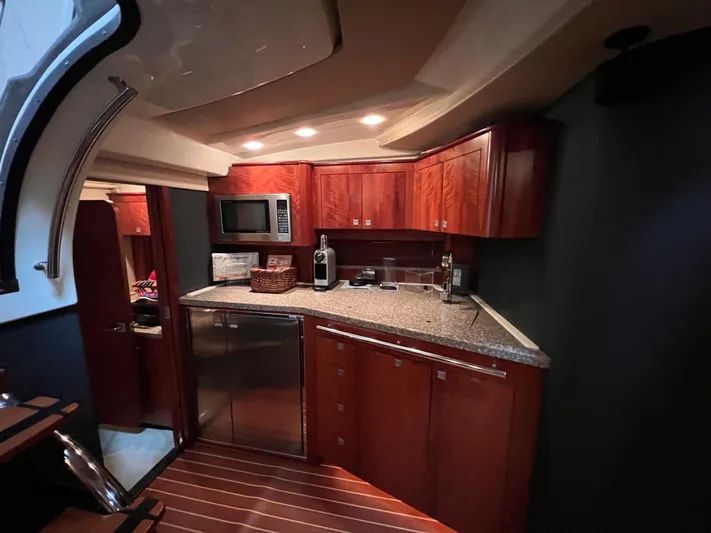  Yacht Photos Pics Luxurious 2009 Monterey 415 SY yacht interior with modern kitchen and wooden cabinetry.