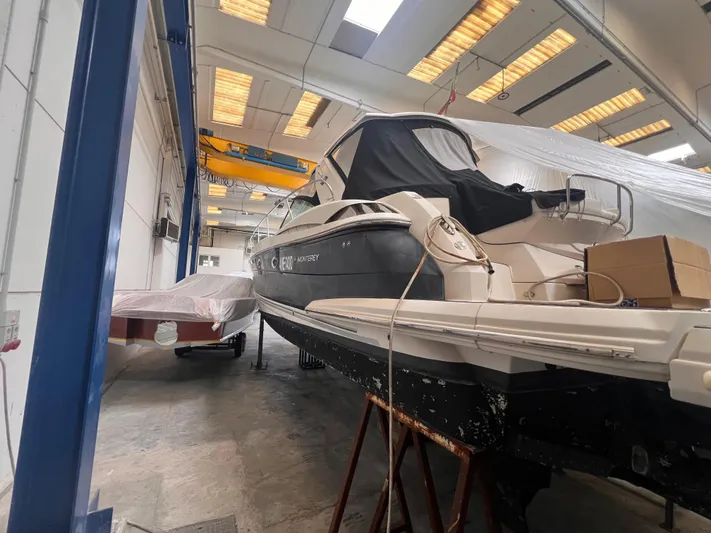  Yacht Photos Pics 2009 Monterey 415 SY yacht in a workshop, partially covered, with overhead lighting.