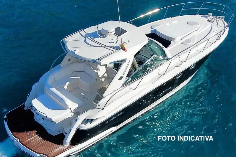  Yacht Photos Pics 2009 Monterey 415 SY yacht cruising on clear blue water, aerial view.