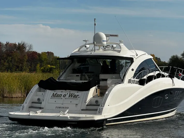 Man O War Yacht Photos Pics 2009 Sea Ray 580 Sundancer yacht cruising on a calm lake near Toronto.