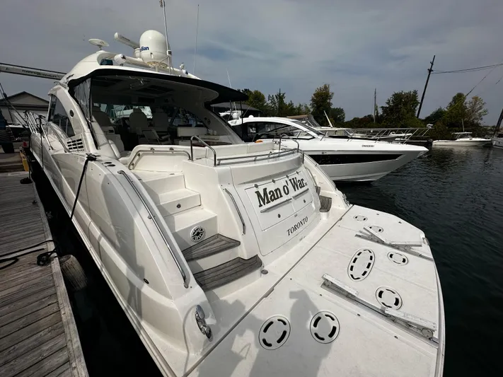 Man O War Yacht Photos Pics 2009 Sea Ray 580 Sundancer yacht docked at marina, rear view.