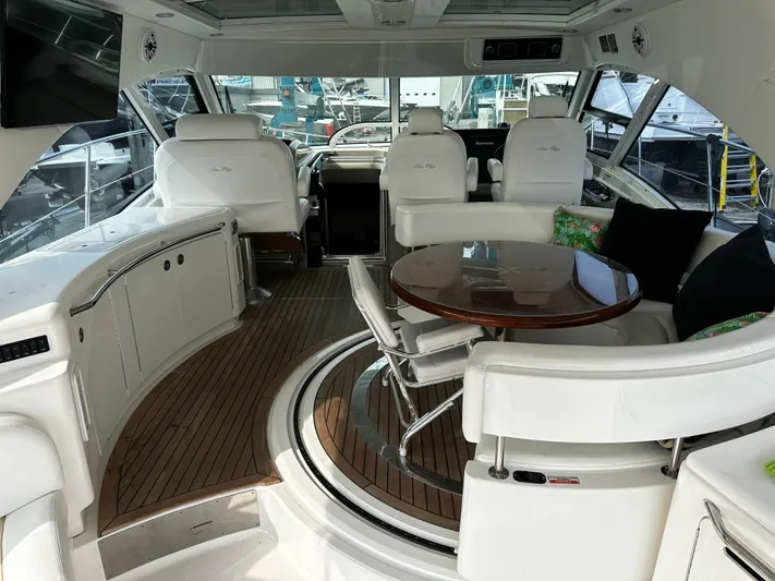 Man O War Yacht Photos Pics Luxurious 2009 Sea Ray 580 Sundancer yacht interior with elegant seating and wooden table.